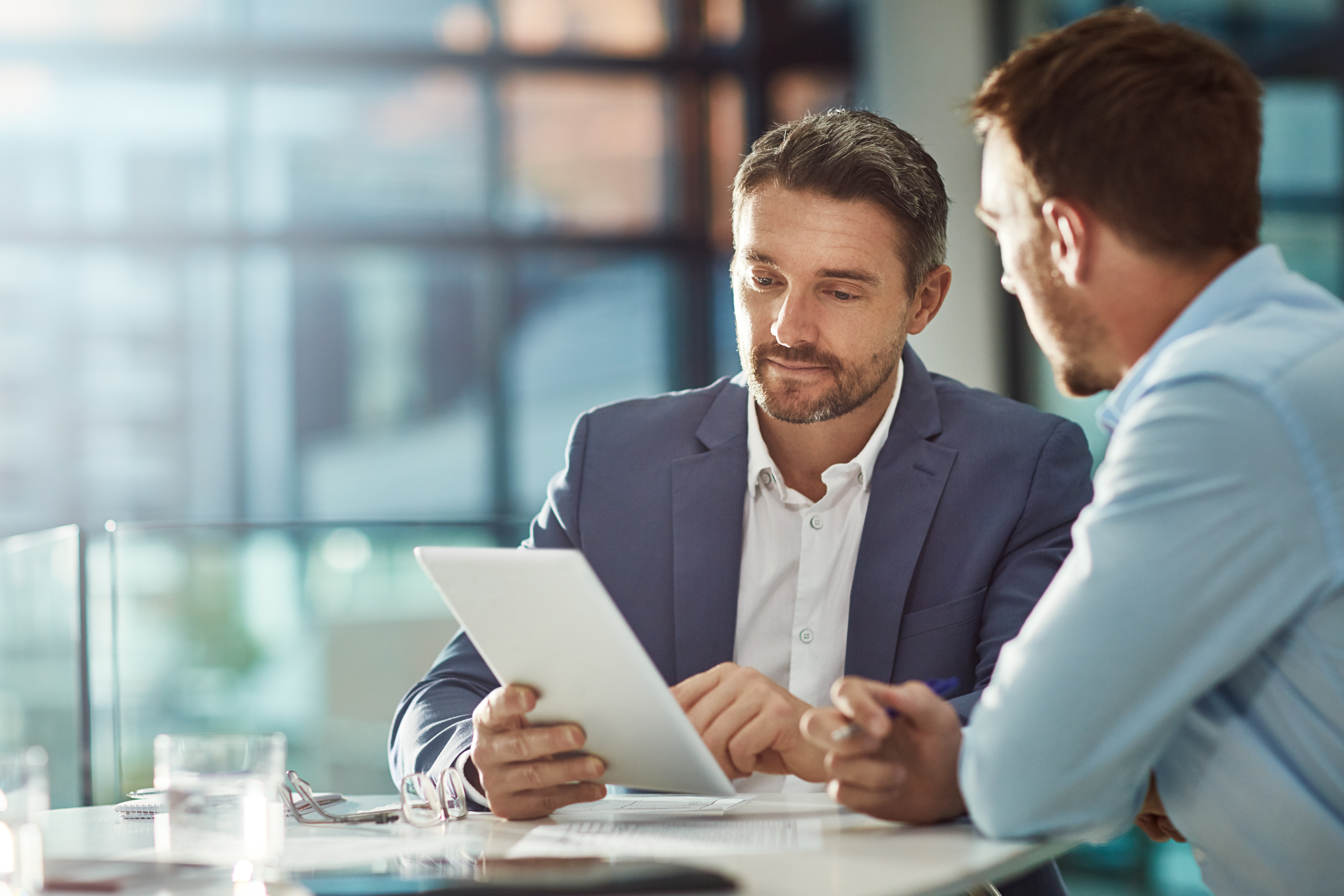 teamwork meeting, tablet and business people in office workplace. collaboration, technology and workers, men or employees with touchscreen planning sales, research or financial strategy in company