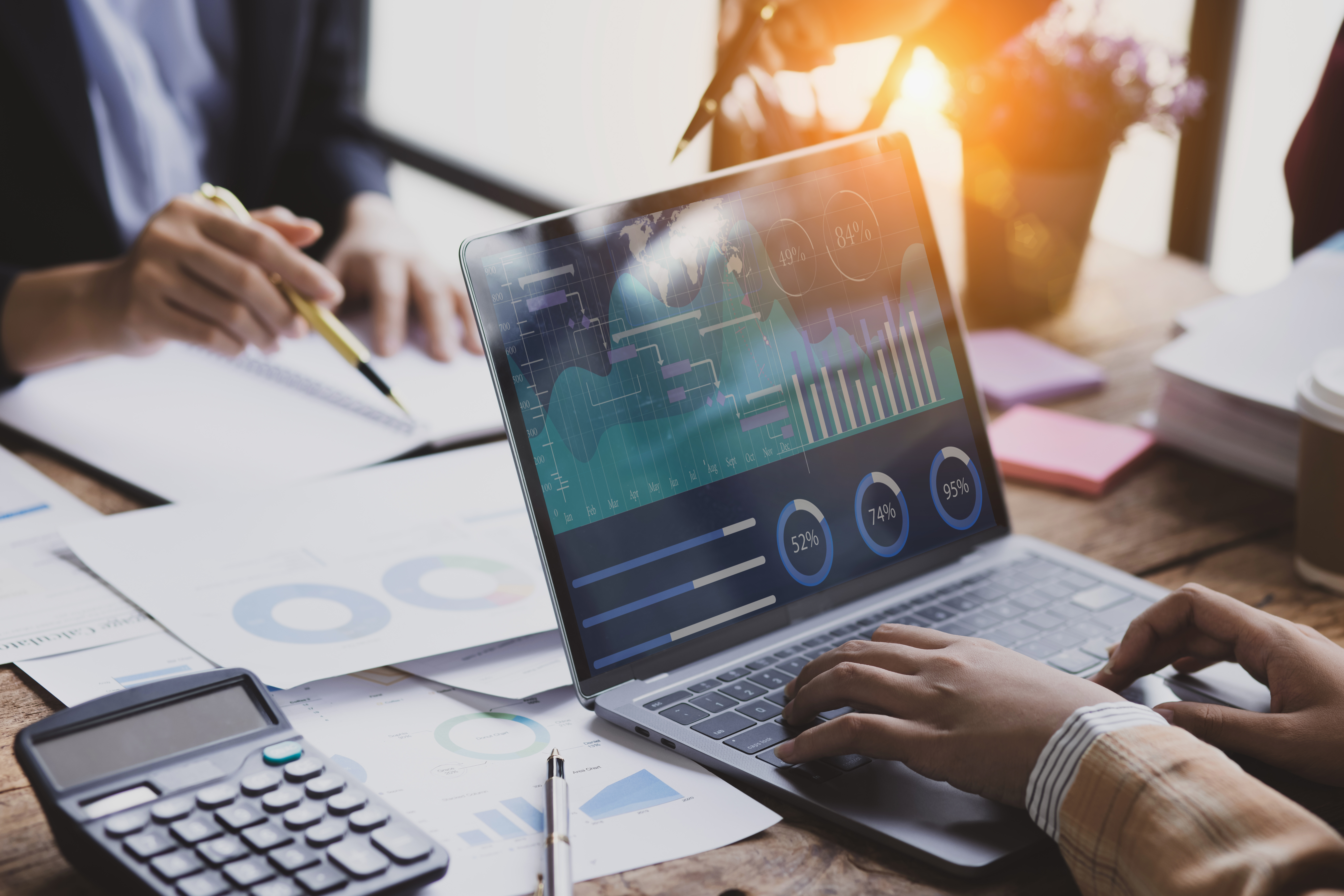 technology and financial advisory services concept. business teamwork and working on digital laptop computer with advisor showing plan of investment to clients at table office. digital marketing.