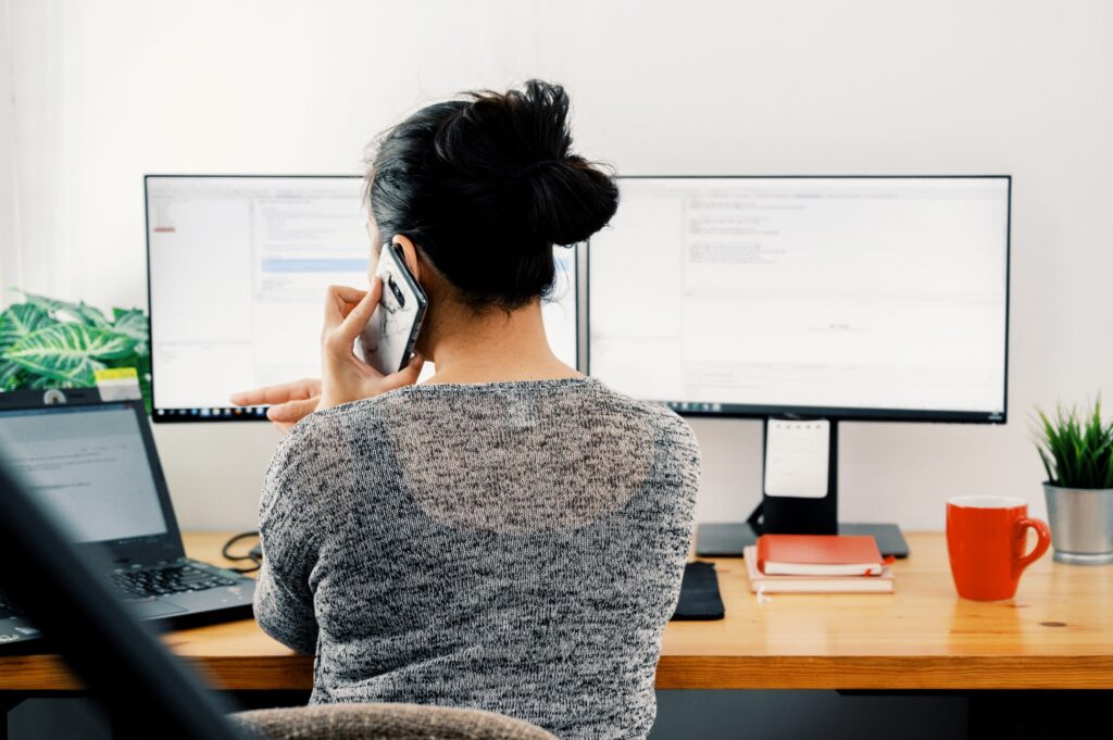 Woman on the phone while working from home