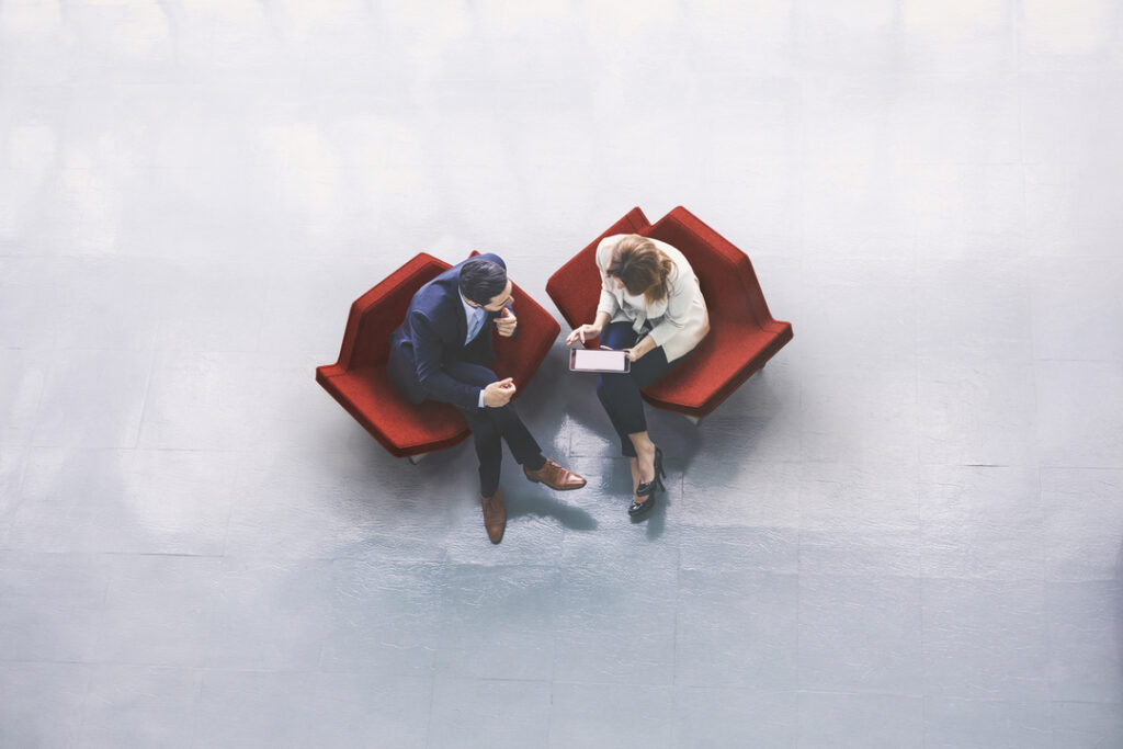overhead view of two business persons in the lobby