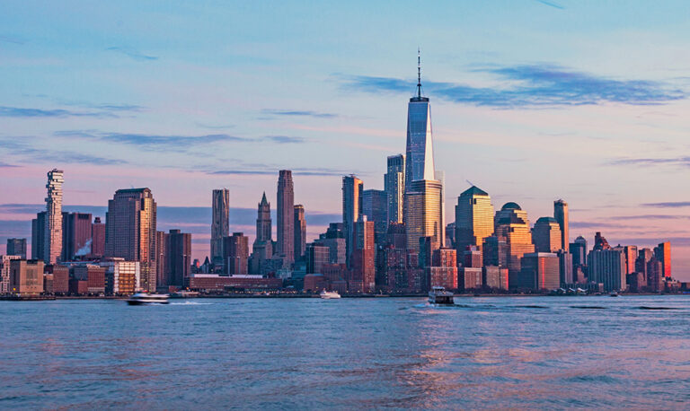 Shot of the sun set being reflected by New York City skyline
