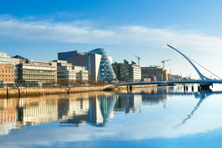modern buildings and offices on liffey river in dublin